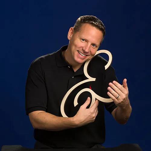 chuck norman, s&a communications owner, with ampersand symbol chuck norman, s&a communications owner, with ampersand symbol